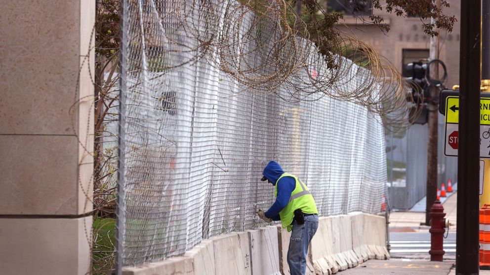 PHOTO: Workers fortify government buildings downtown as the city prepares for possible unrest following the verdict in the Derek Chauvin murder trial, April 19, 2021, in Minneapolis.