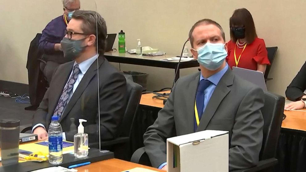 In this image from video, defense attorney Eric Nelson, left, and former Minneapolis police officer Derek Chauvin listen as Hennepin County Judge PeterÂ Cahill presides over pre-trial motions prior to opening statements, March 29, 2021, in Minneapolis.