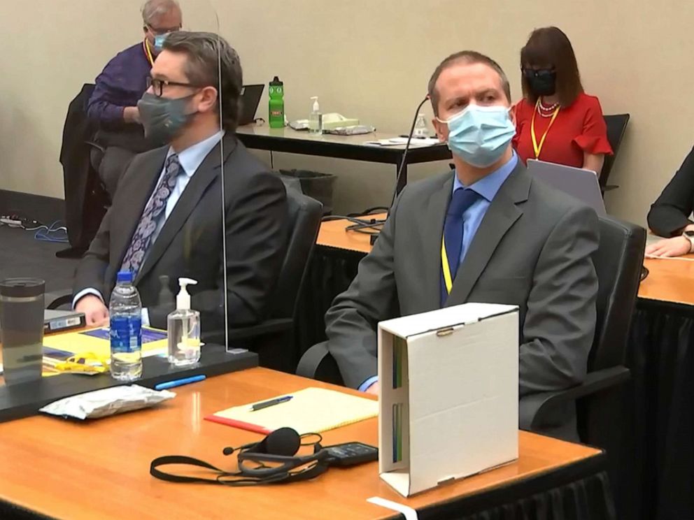 In this image from video, defense attorney Eric Nelson, left, and former Minneapolis police officer Derek Chauvin listen as Hennepin County Judge Peter??Cahill presides over pre-trial motions prior to opening statements, March 29, 2021, in Minneapolis.