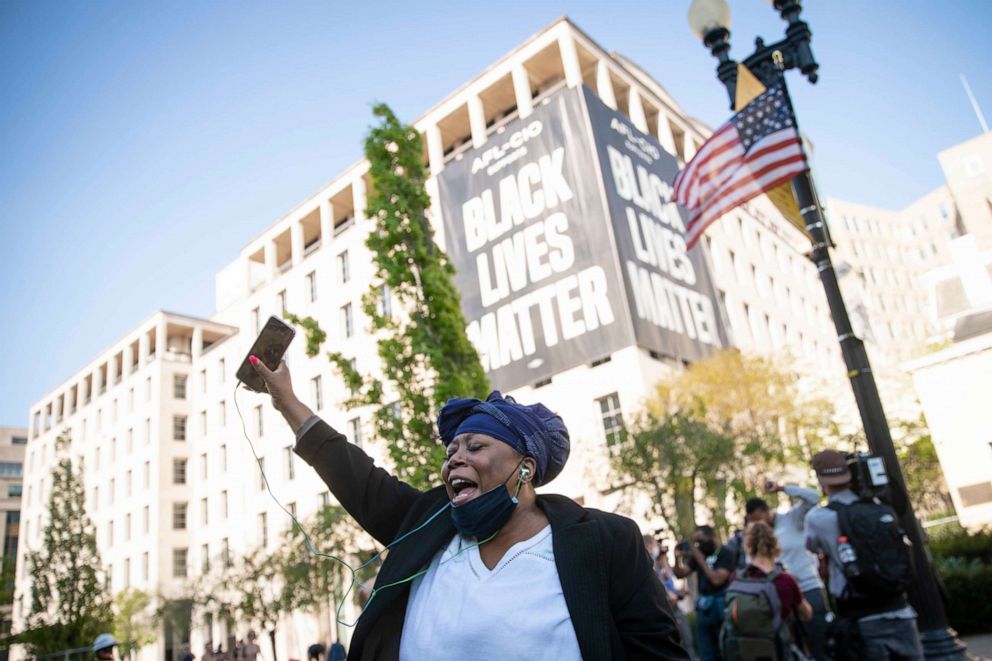 PHOTO: A person celebrates the verdict of the Derek Chauvin trial at Black Lives Matter Plaza near the White House on April 20, 2021, in Washington.
