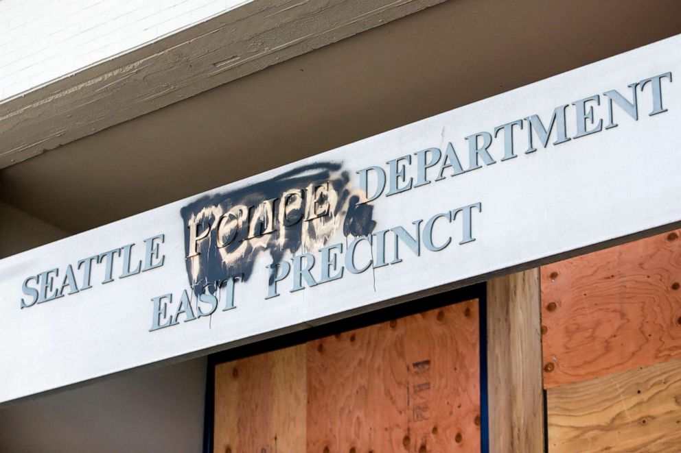 PHOTO: The word "people" is spray painted over the word "police" on the closed Seattle Police Department's East Precinct now surrounded by the area known as the Capitol Hill Autonomous Zone (CHAZ), in Seattle, June 11, 2020.