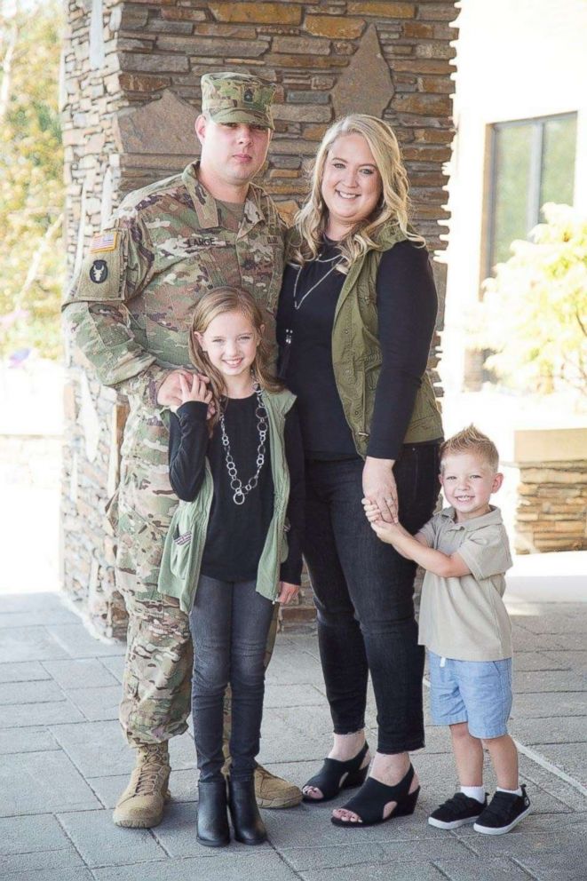 PHOTO: Mikayla Lange, 9, of Ankeny, Iowa, standing with father, Sgt. First Class Robert Lange, her mother and little brother. 