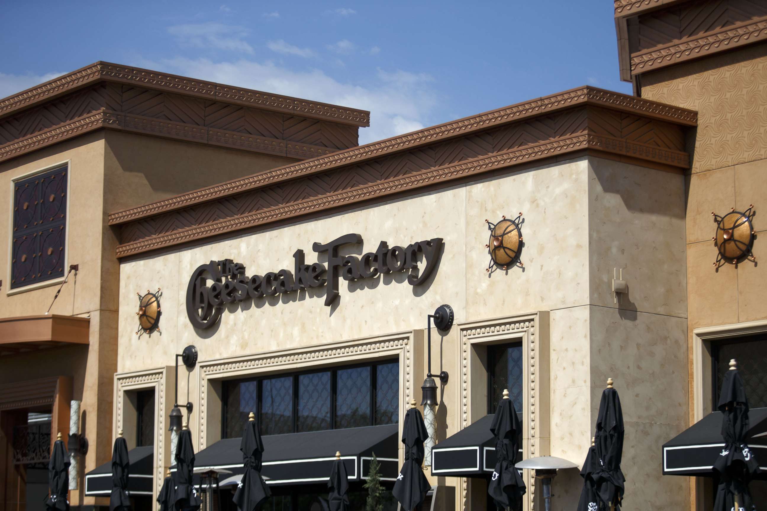 PHOTO: Signage for Cheesecake Factory Inc. is displayed outside of a restaurant, Aug. 1, 2017. 