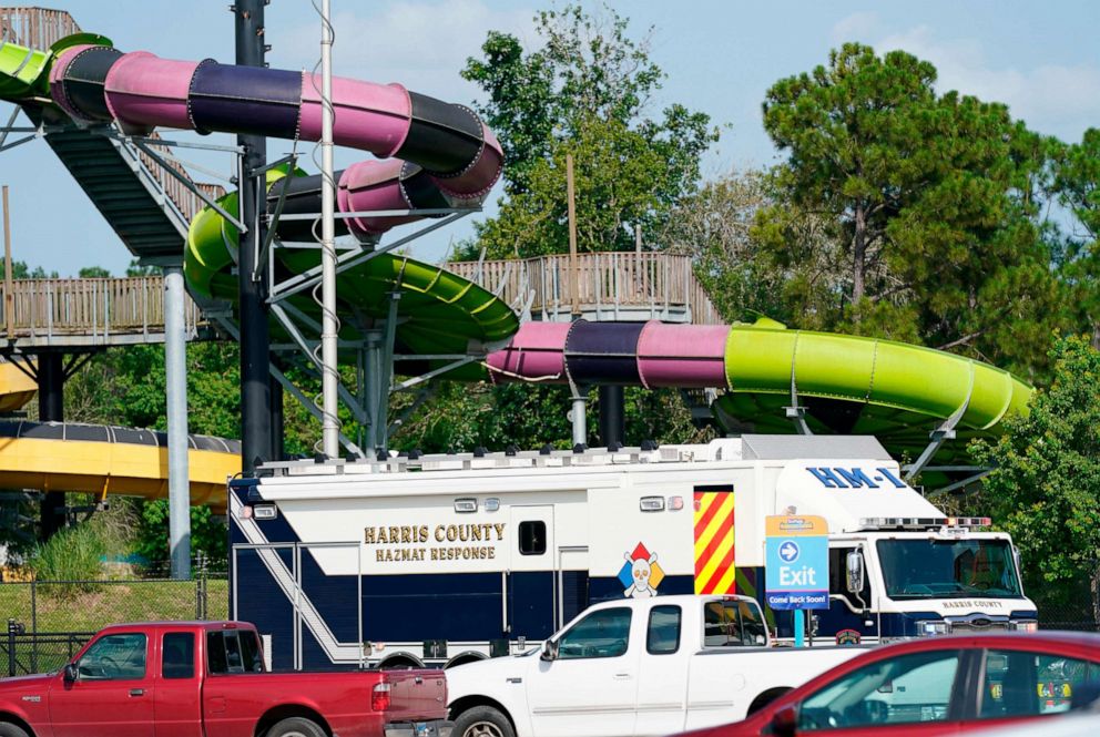 PHOTO: Emergency personnel vehicles are parked near the scene where people are being treated after chemical leak at Six Flags Hurricane Harbor Splashtown, July 17, 2021 in Spring, Texas.