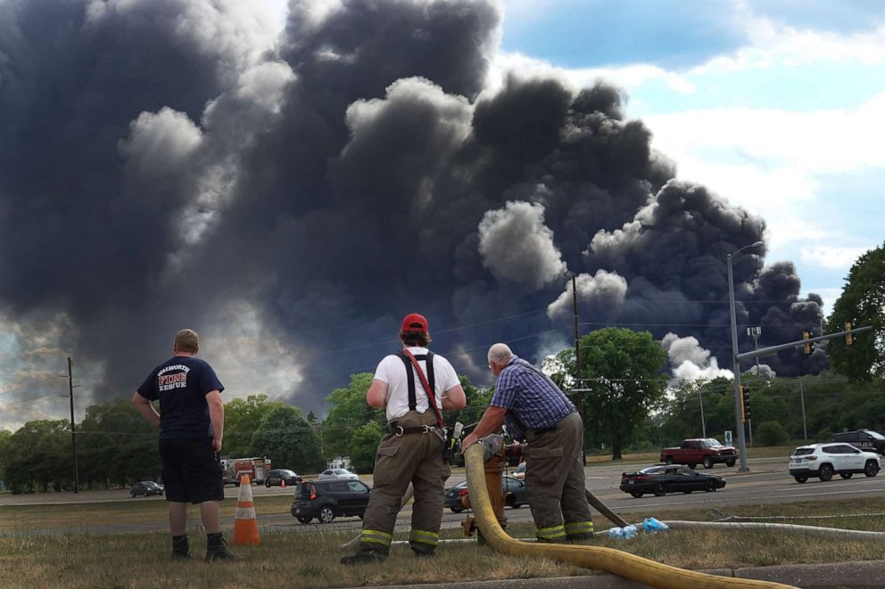 PHOTO: Firefighters from northern Illinois and southern Wisconsin fill their tanker trucks as they continue a day-long battle to extinguish the industrial fire at Chemtool Inc., June 14, 2021, in Rockton, Illinois.
