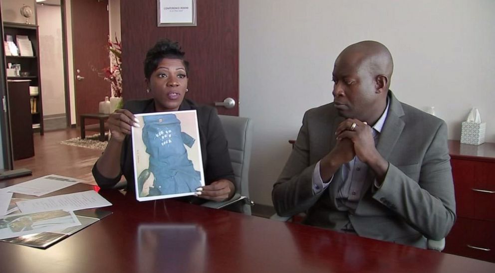 PHOTO: Attorney N. Lucy Chukwurah holds up a photo of Taye Falobi's overalls, defaced with the words "Make LZ Great Again," a reference to Lubrizol, a massive chemical company where Falobi works, and the Donald Trump slogan.KTRK