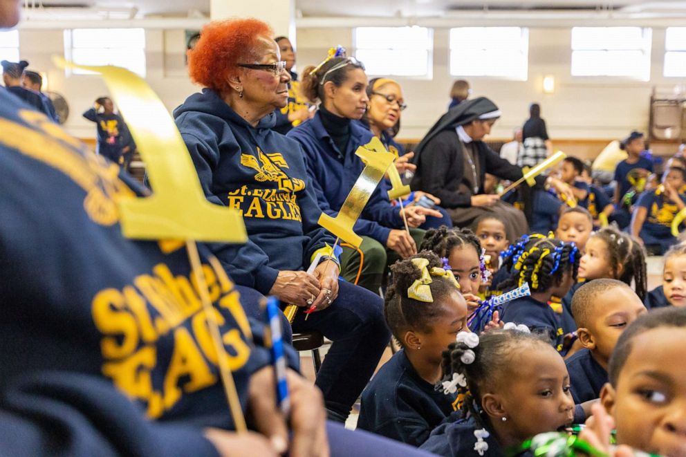PHOTO: Family, friends, and community members cheer on the students of St. Ethelreda School during their pep rally.