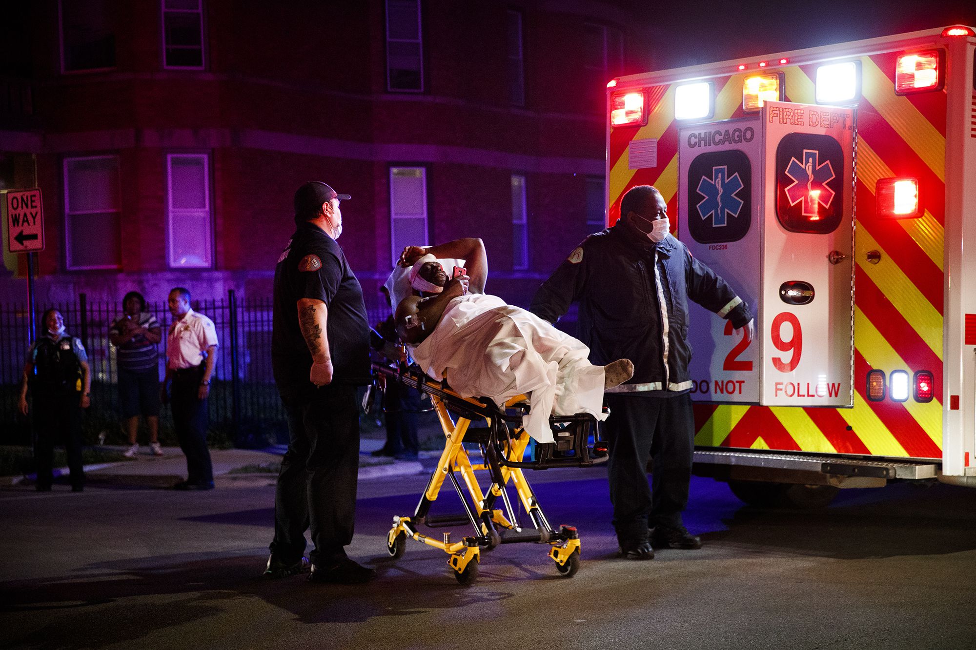 PHOTO: Members of the Chicago Fire Department transport a person who was stabbed during Memorial Day weekend, May 24, 2020 in Chicago.