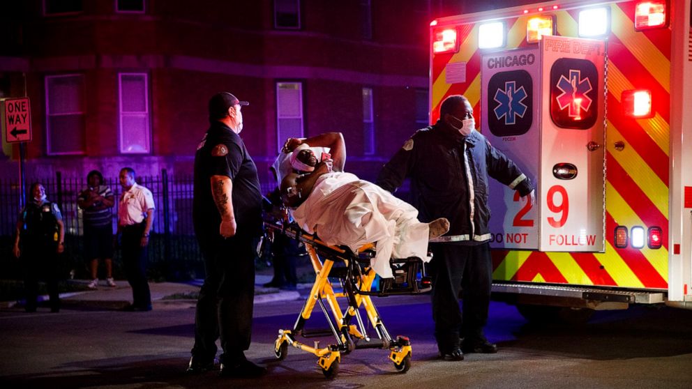 PHOTO: Members of the Chicago Fire Department transport a person who was stabbed during Memorial Day weekend, May 24, 2020 in Chicago.