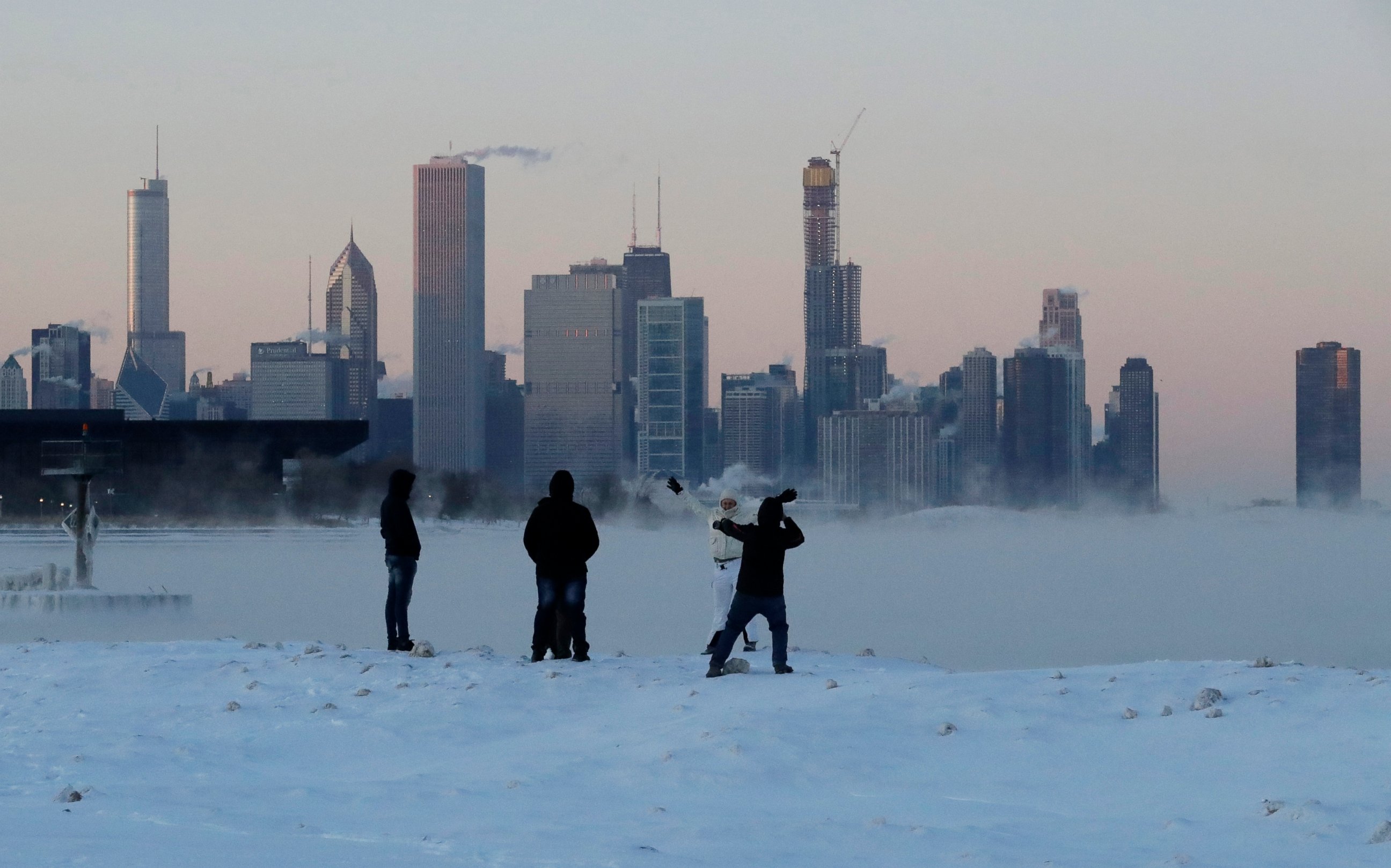 PHOTO: People enjoy at the Lake Michigan at 31st Street Harbor, Wednesday, Jan. 30, 2019, in Chicago.