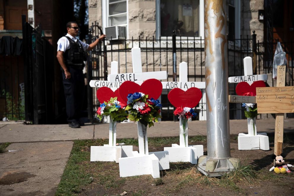 PHOTO: Wood crosses hold victims' names at the scene of a fire that killed at least eight people, including six children, Aug. 26, 2018, in the Little Village neighborhood of Chicago.