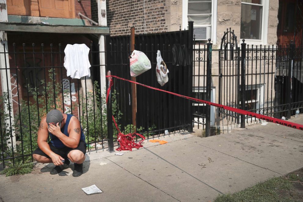PHOTO: Family, friends and neighbors mourn the loss of eight people, including six children, who perished in an early-morning fire, Aug. 26, 2018, in Chicago.