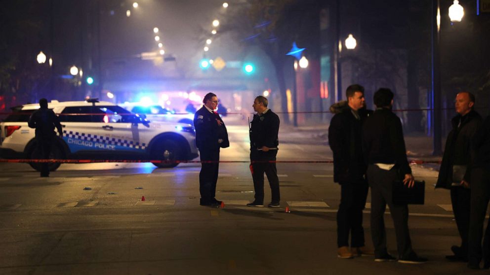 PHOTO: Police investigate the scene where officials said as many as 14 people were shot on Oct. 31, 2022, in Chicago, Illinois.