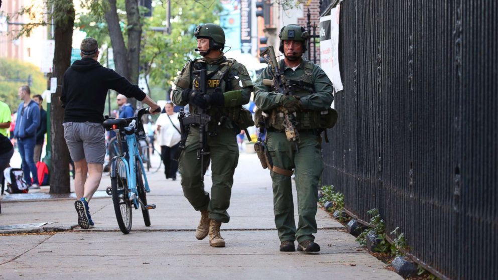 Armed police officers walk the streets of Chicago during 2017 Bank of America Chicago Marathon, Oct. 8, 2017 in Chicago.