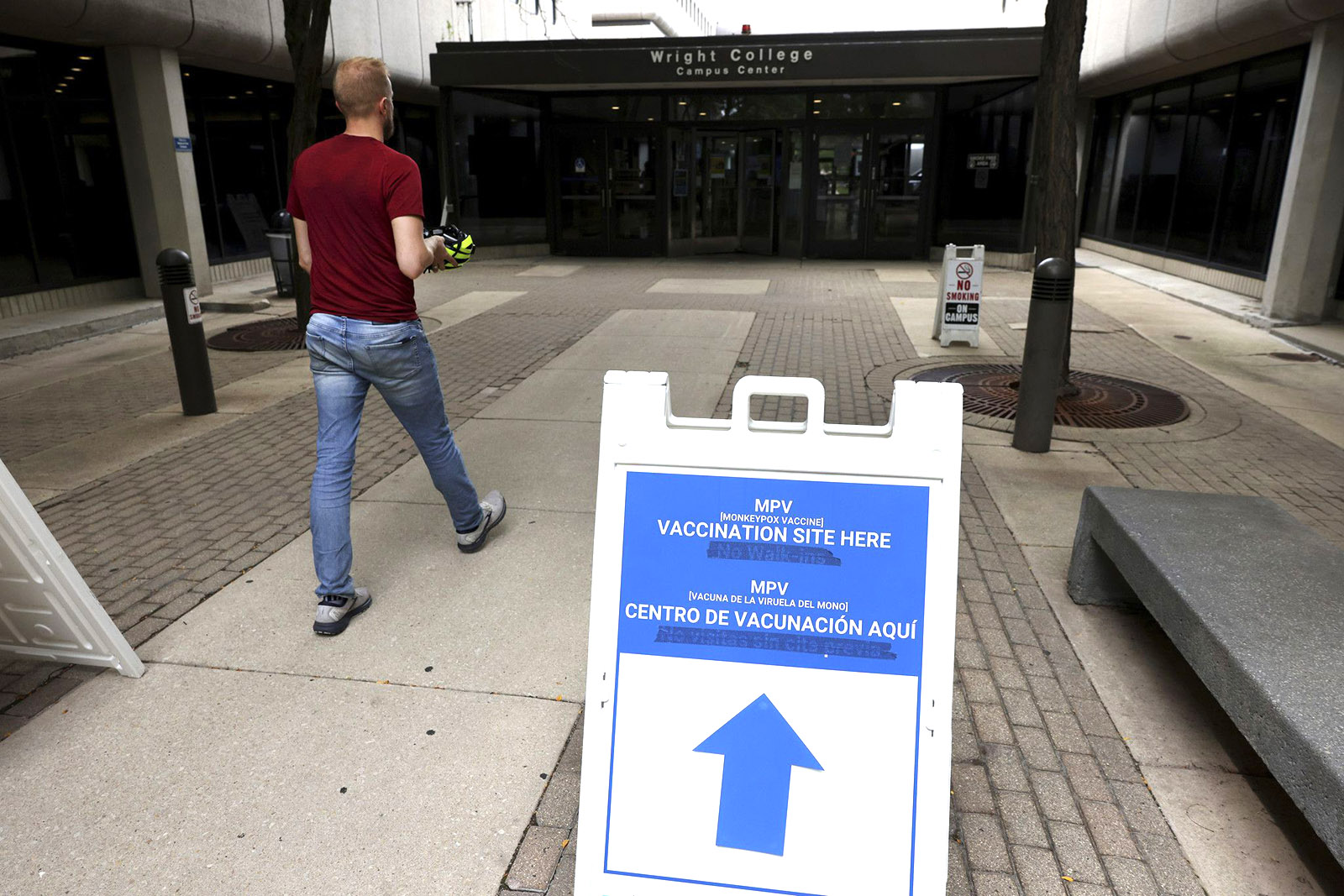 PHOTO: People enter a COVID-19 and monkeypox vaccine clinic at Wilbur Wright College in Chicago. (Chris Sweda/Chicago Tribune/Tribune News Service via Getty Images)