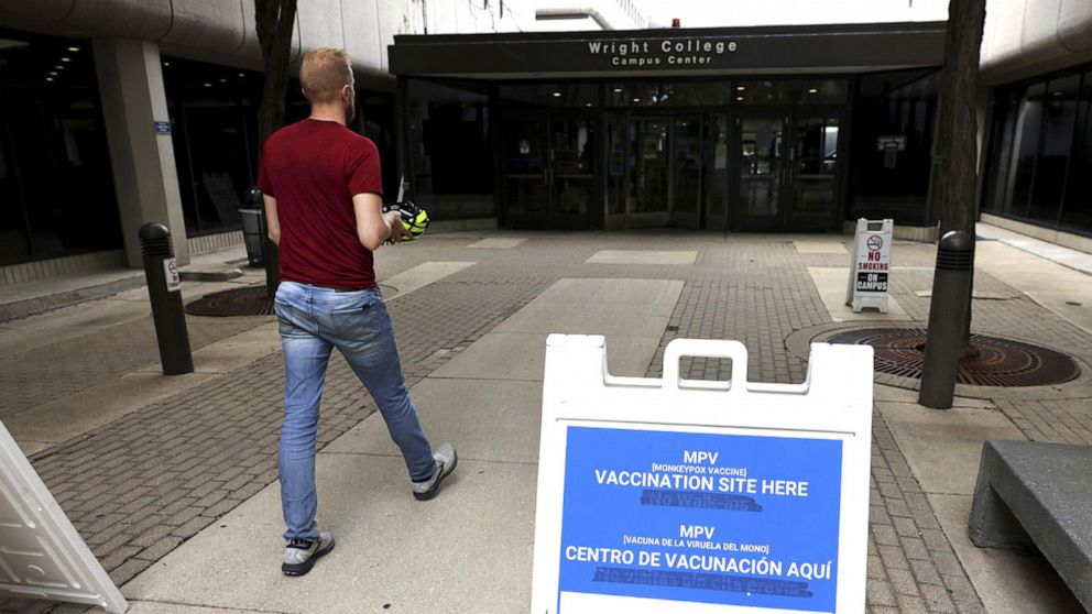 PHOTO: People enter a COVID-19 and monkeypox vaccine clinic at Wilbur Wright College in Chicago. (Chris Sweda/Chicago Tribune/Tribune News Service via Getty Images)