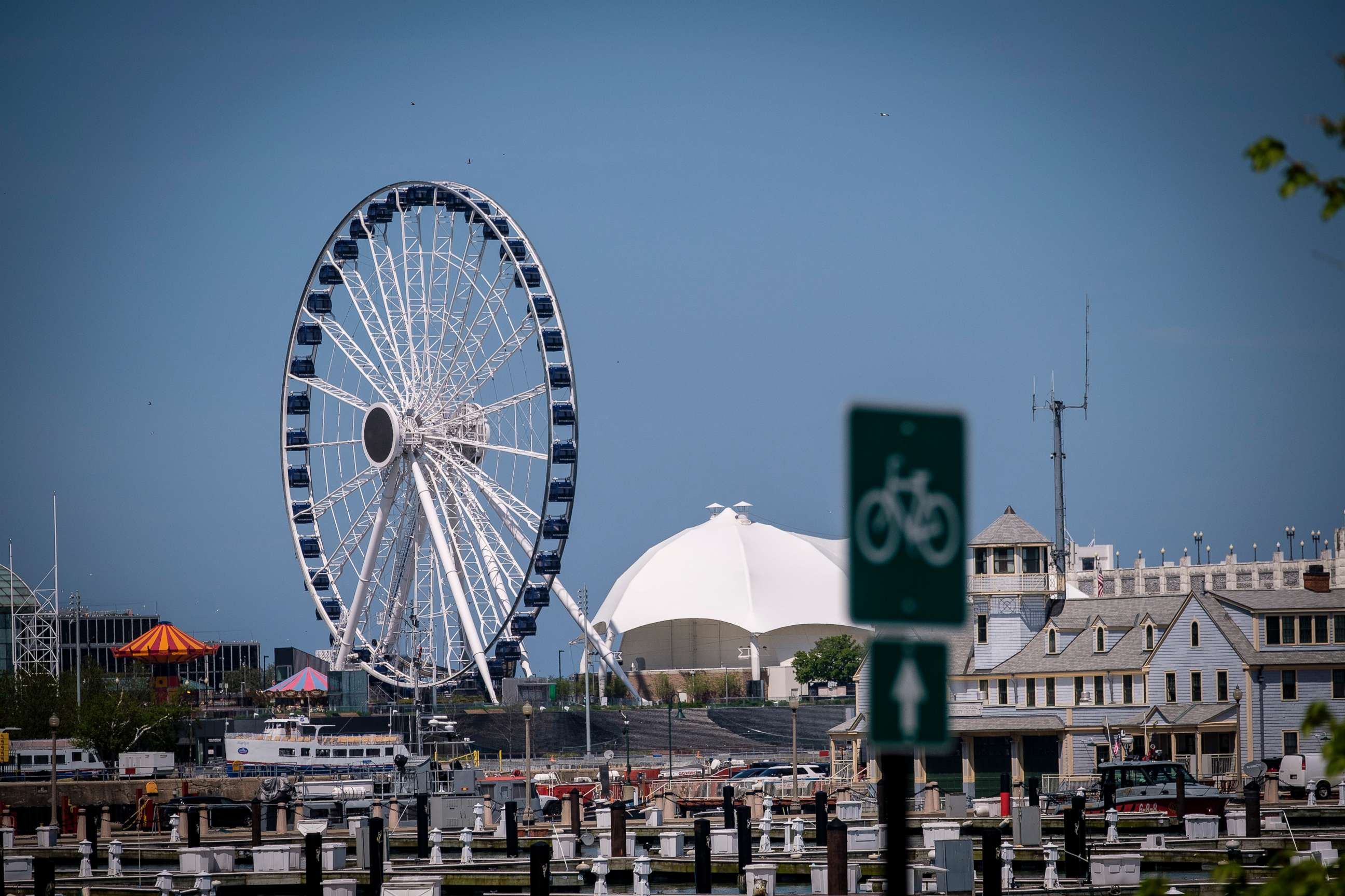 PHOTO: The Navy Pier Ferris Wheel stands behind empty boat slips on May 15, 2020, in Chicago.