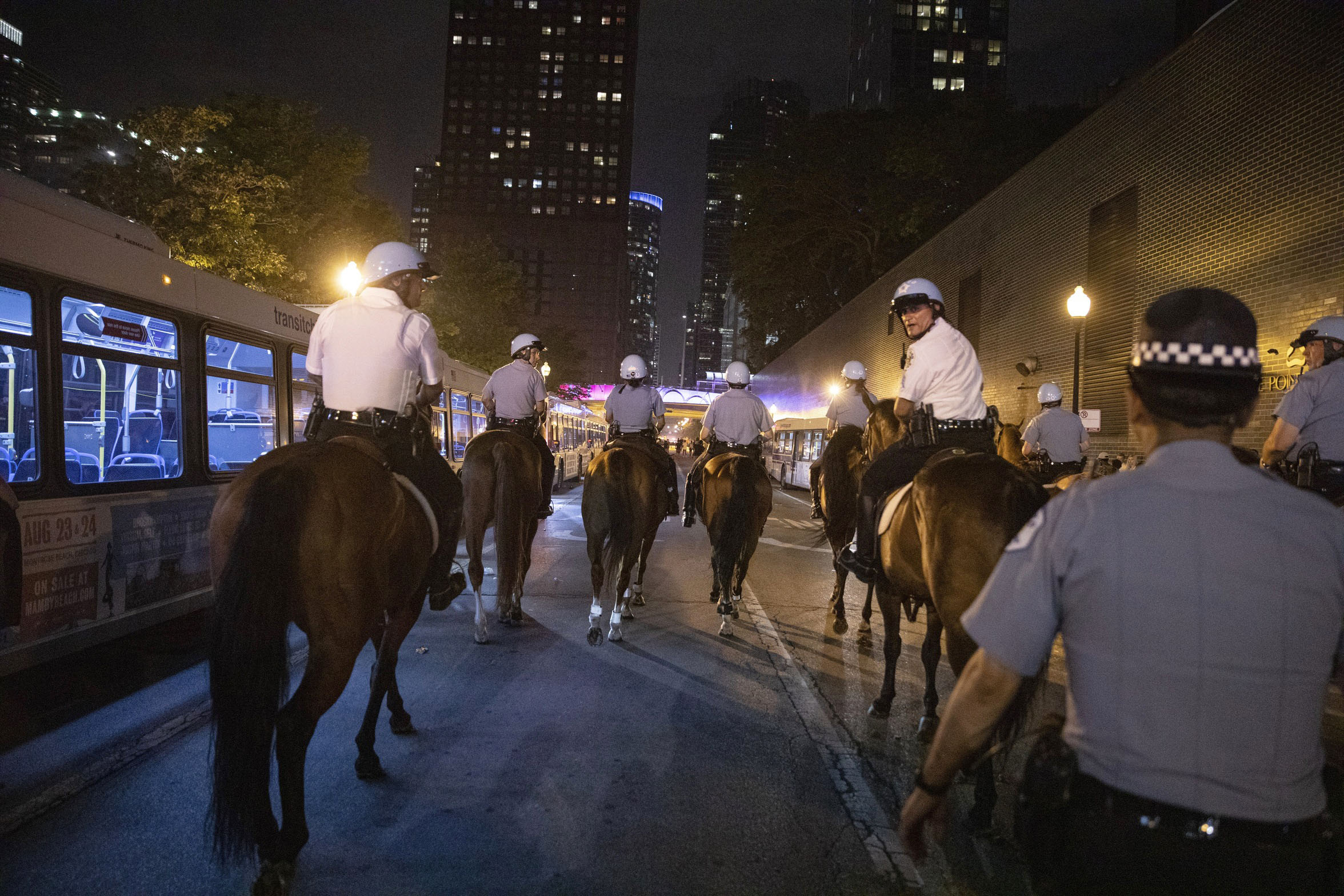 PHOTO: Chicago Police Department officers guard people as they stream out of Chicago's Navy Pier after reports of stabbings and threatening injuries after the 4th of July celebrations, July 4, 2019.