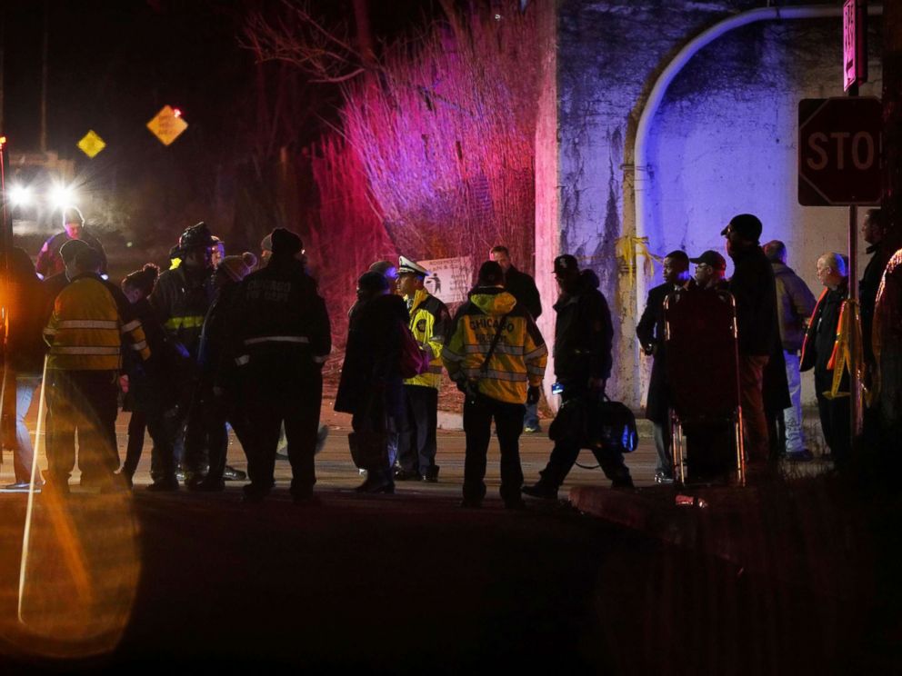 PHOTO: South Shore passengers are transferred to buses at the 103rd Street Rosemoor stop after two Chicago officers were killed by a train while investigating a call of shots fired, Dec. 17, 2018.