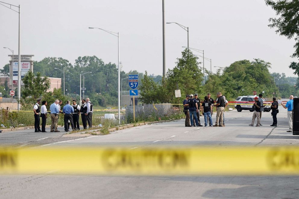 PHOTO: Law enforcement officers investigate a crime scene near the border between the Morgan Park and West Pullman neighborhoods, July 7, 2021, in Chicago.