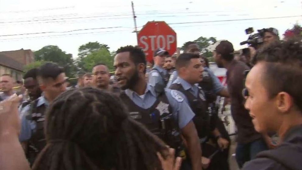   Protesters fought Chicago police officers following a deadly shootout on Saturday, July 13, 2018. 