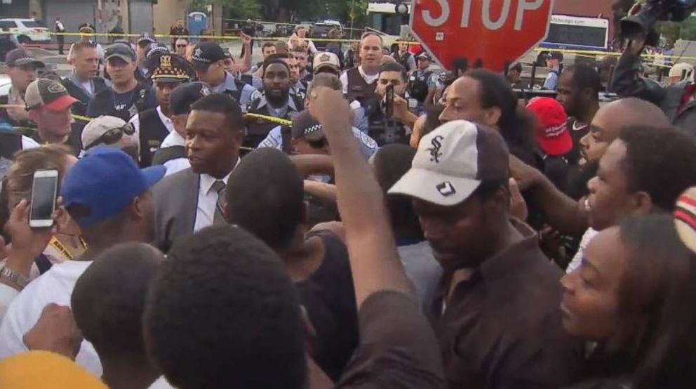   Protesters fought Chicago police officers following a deadly shootout on Saturday, July 13, 2018. 