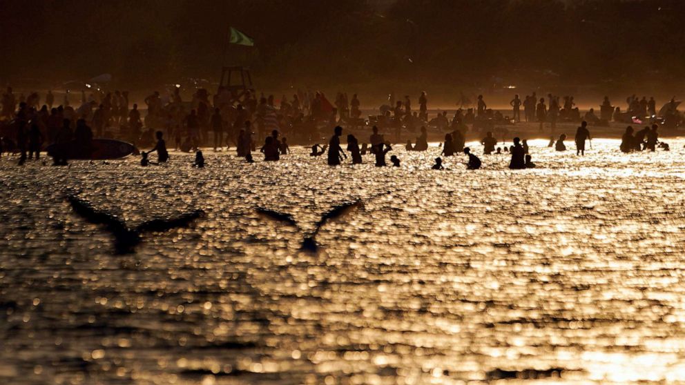 PHOTO: Beach goers crowd Montrose Beach along Lake Michigan, Aug. 23, 2023, in Chicago.