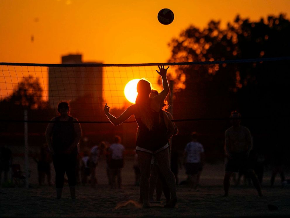 PHOTO: FILE - People play volleyball at sunset on Montrose Beach, Aug. 23, 2023, in Chicago.