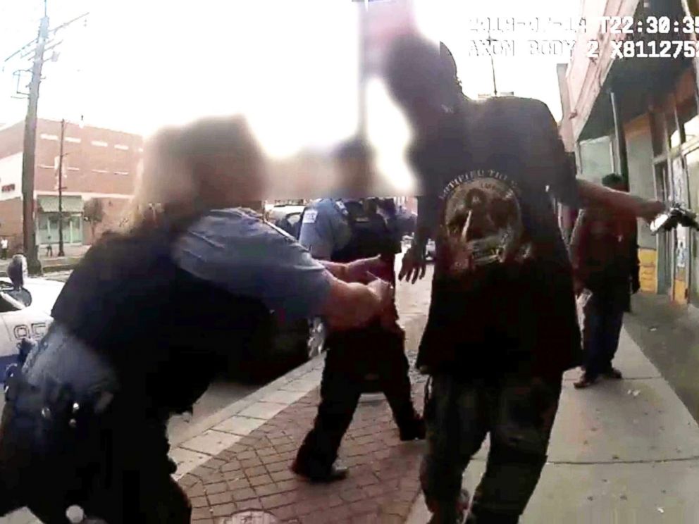PHOTO: Chicago Police attemps to grab Harith Augustus, 37, who was fatally shot by police moments later, in this still image from police body camera video footage taken in Chicago on July 14, 2018 and released on July 15, 2018.