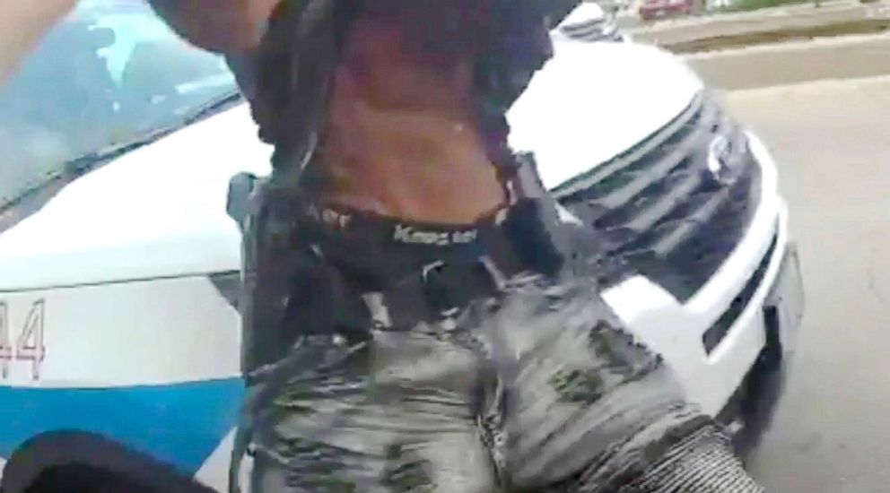 PHOTO: Frame grab from a handout body camera video released July 15, 2018, by the Chicago Police Department shows Harith Augustus with what appears to be a handgun in Chicago, July 14, 2018.