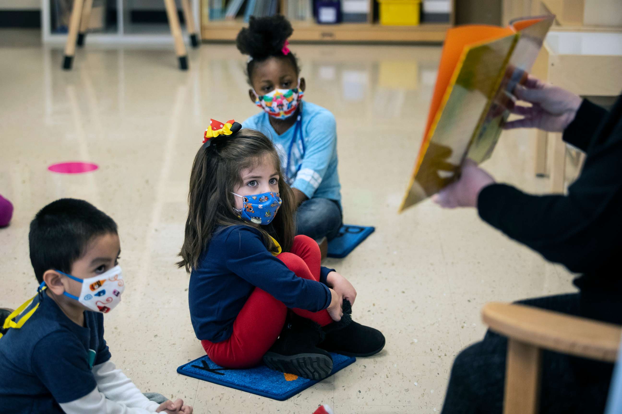 PHOTO: Pre-kindergarten students listen as their teacher reads a story at Dawes Elementary in Chicago, Jan. 11, 2021.