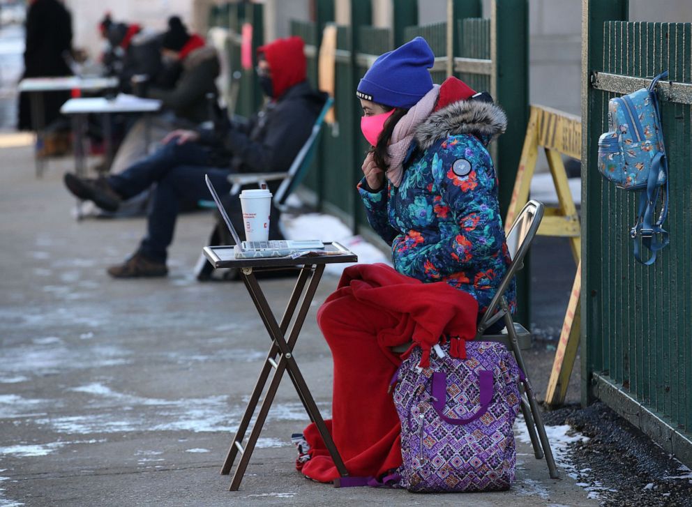 PHOTO: Stephanie Chavez teaches outside the Seward Communication Arts Academy. Fellow Chicago Teachers Union members staged a teach-out, Jan. 21, 2021, to protest the city's reopening plan for public schools.