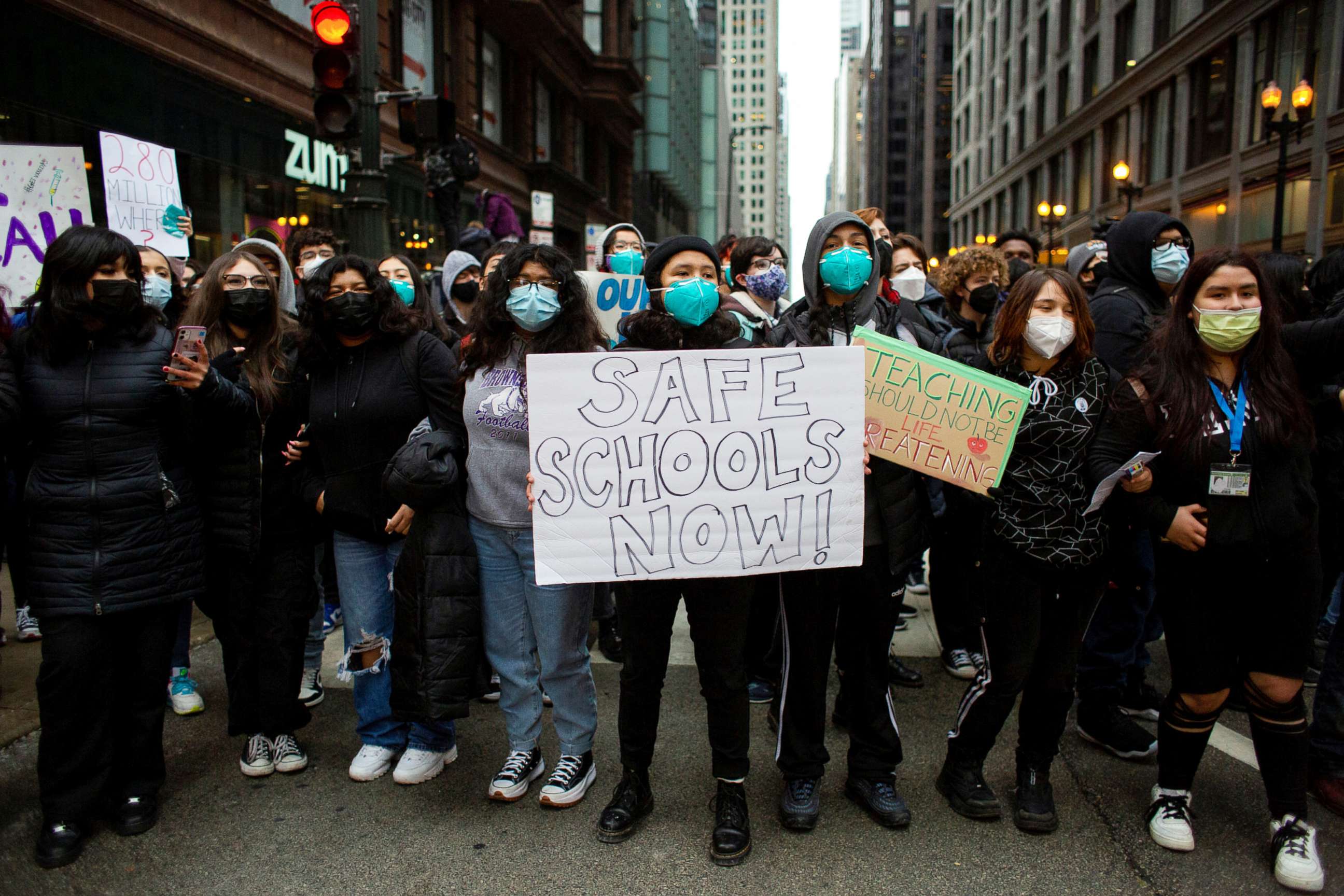 PHOTO: Students gather outside of Chicago Public Schools headquarters to stage one of several walkouts for COVID Safety at city high schools due to the spread of Omicron, in Chicago, Jan. 14, 2022.
