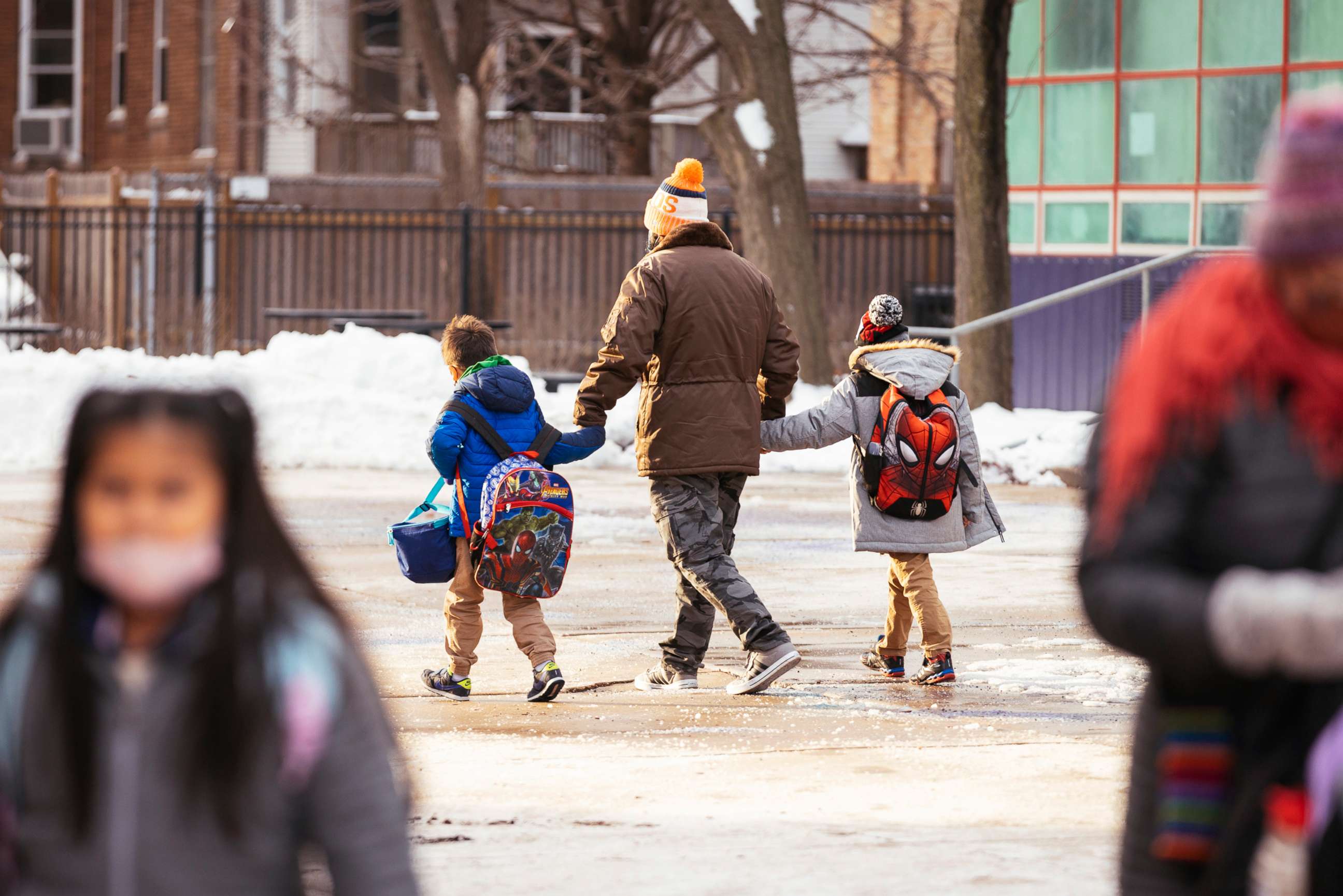 PHOTO: Students leave Darwin Elementary School in Chicago at the end of the day, Tuesday, Jan. 4, 2022.