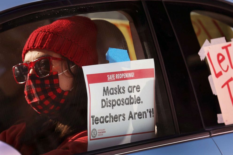 PHOTO: Members of the Chicago Teachers Union and their supporters participate in a car caravan around City Hall to protest against in-person learning in Chicago public schools on Jan. 10, 2022 in Chicago.