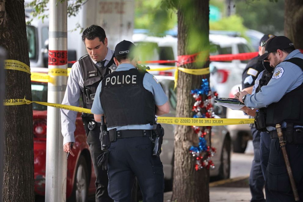 PHOTO: Police investigate a crime scene where three people were shot at the Wentworth Gardens housing complex in the Bridgeport neighborhood on June 23, 2021, in Chicago.