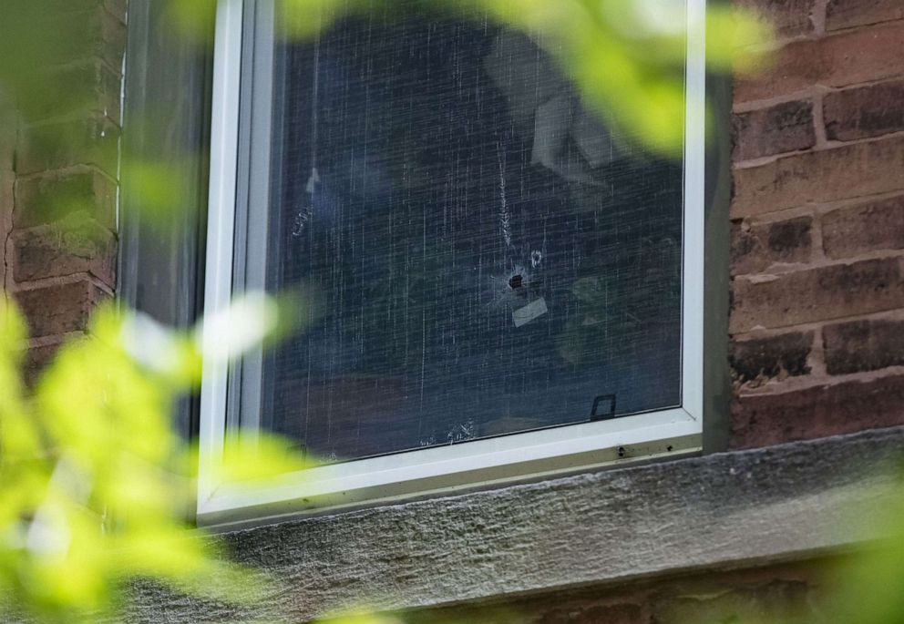 PHOTO: A bullet hole in the second floor window of a building, June 28, 2020, where a 10-year-old girl was shot and killed inside an apartment by a stray bullet in the 3500 block of West Dickens Avenue in Chicago.