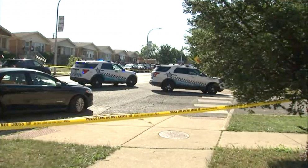 PHOTO: Police officers work outside the area where two sisters were shot on Aug. 15, 2021 in Belmont Central on Chicago's Northwest Side, according to Chicago police.