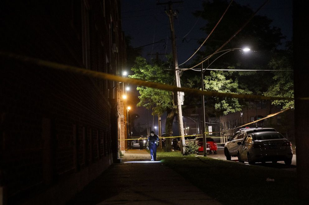 PHOTO: Police work the scene where a 19-year-old man was shot in the 400 block of West 77th Street in Chicago, on July 3, 2020.