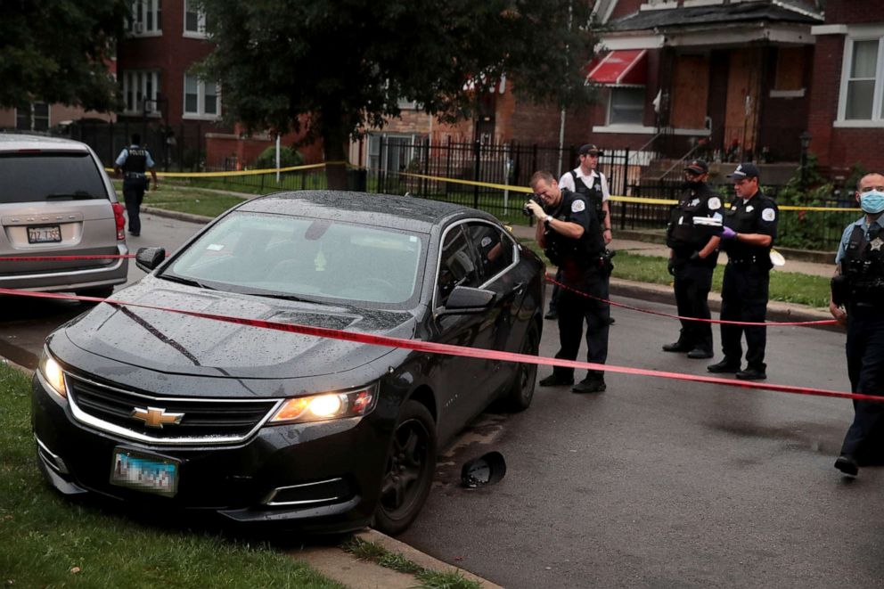 PHOTO: Police investigate the scene of a shooting in the Auburn Gresham neighborhood on July 21, 2020 in Chicago.