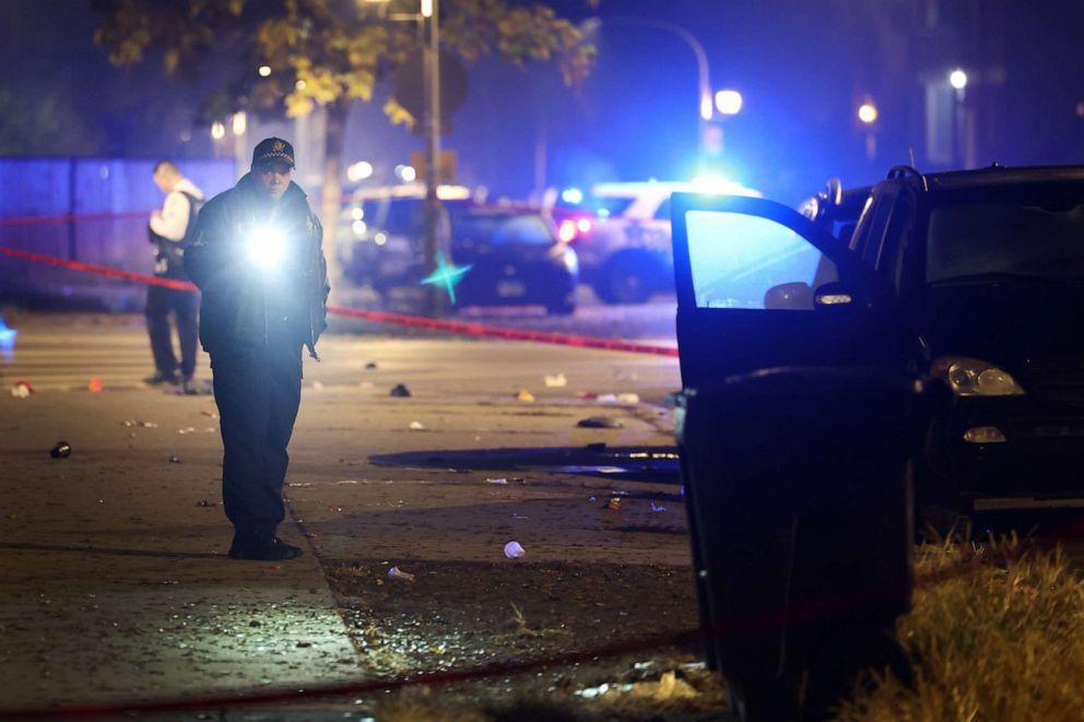 PHOTO: Police investigate the scene where as many as 14 people were shot on Oct. 31, 2022 in Chicago, Illinois.