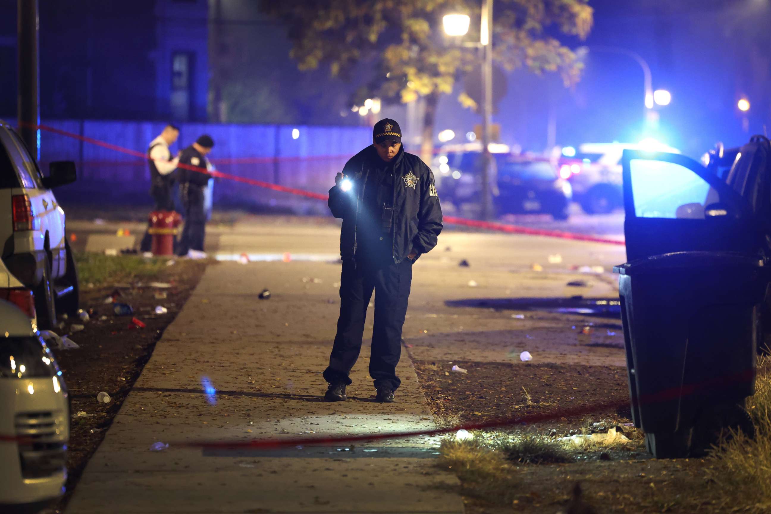 PHOTO: Police investigate the scene where as many as 14 people were said to have been shot on Oct. 31, 2022, in Chicago, Illinois.