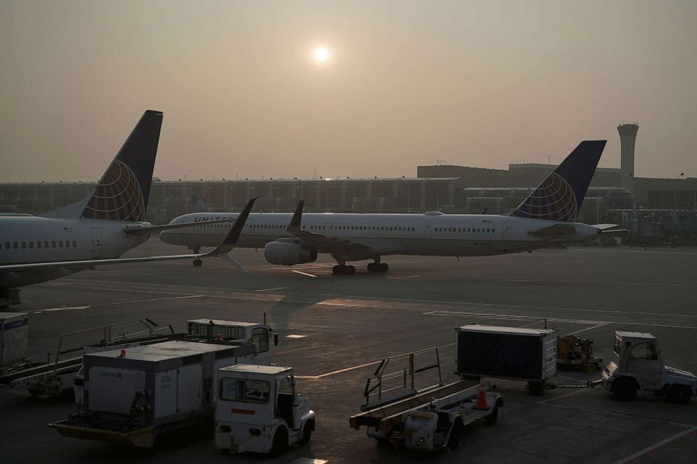 PHOTO: A plane taxis to the runway as smoke from wildfires in Canada reduces visibility, June 28, 2023, at O'Hare International Airport in Chicago.