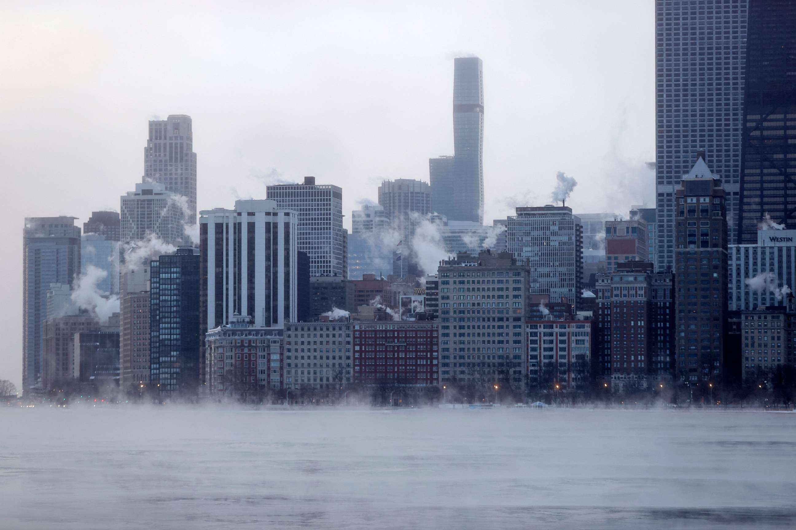 PHOTO: Mist rises from Chicago and Lake Michigan at sunrise on Dec. 23, 2022.