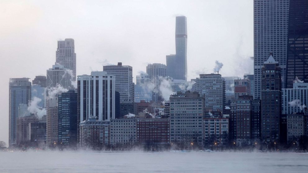 PHOTO: Mist rises from Chicago and Lake Michigan at sunrise on Dec. 23, 2022.
