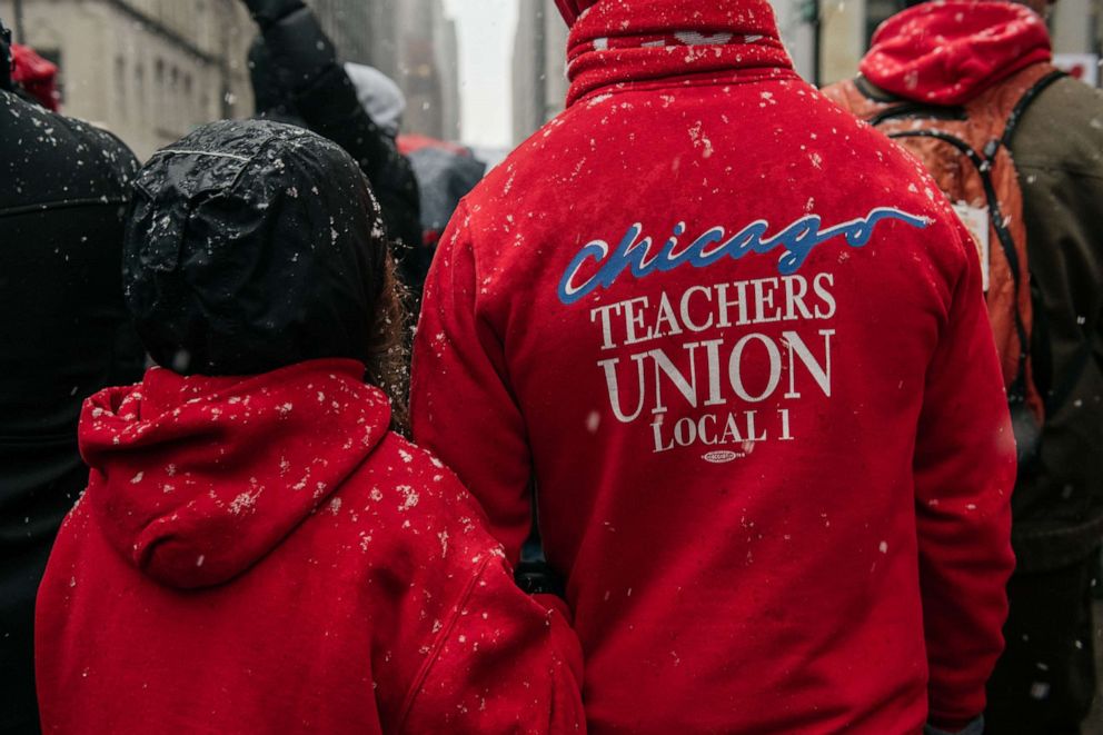 PHOTO: Braving snow and cold temperatures, thousands marched through the streets near City Hall during the 11th day of an ongoing teachers strike, Oct. 31, 2019, in Chicago, Illinois.