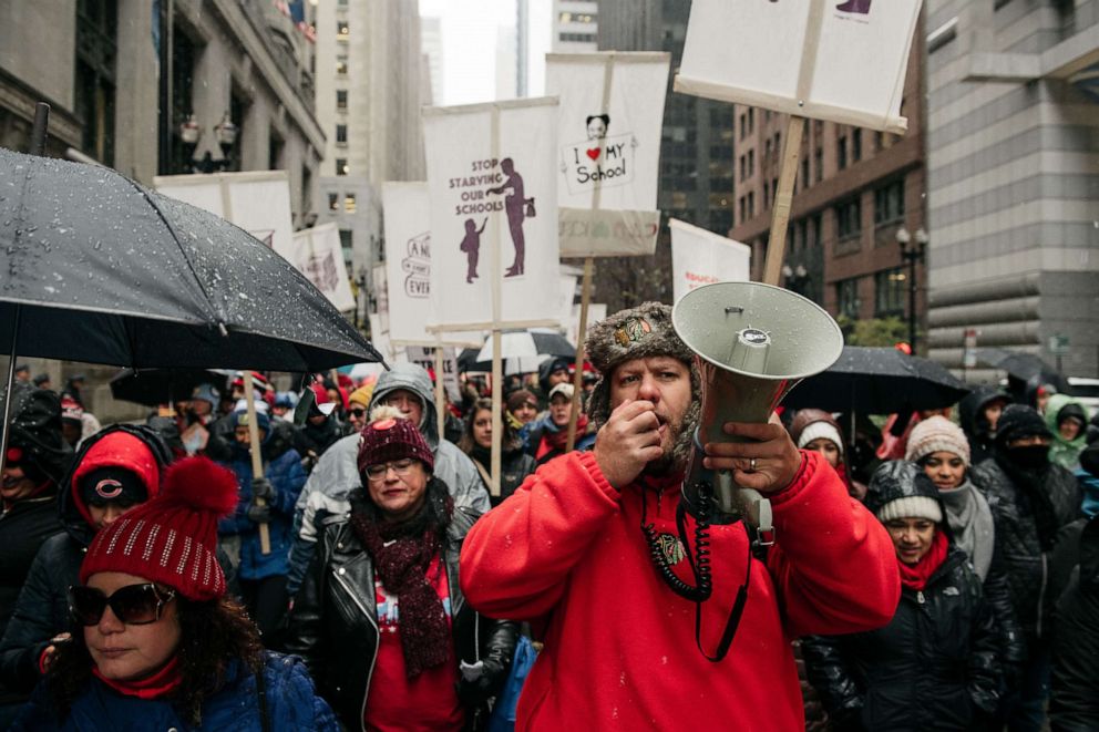PHOTO: Thousands march through the streets near City Hall during the 11th day of an ongoing teachers strike in Chicago, Oct. 31, 2019.
