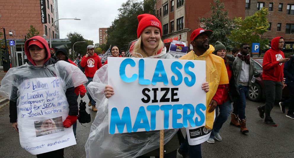 PHOTO: Chicago Teachers Union members and supporters march through the streets of Chicago's Hyde Park neighborhood during the "Nurse in Every School" Solidarity March for Justice, Oct. 21, 2019.