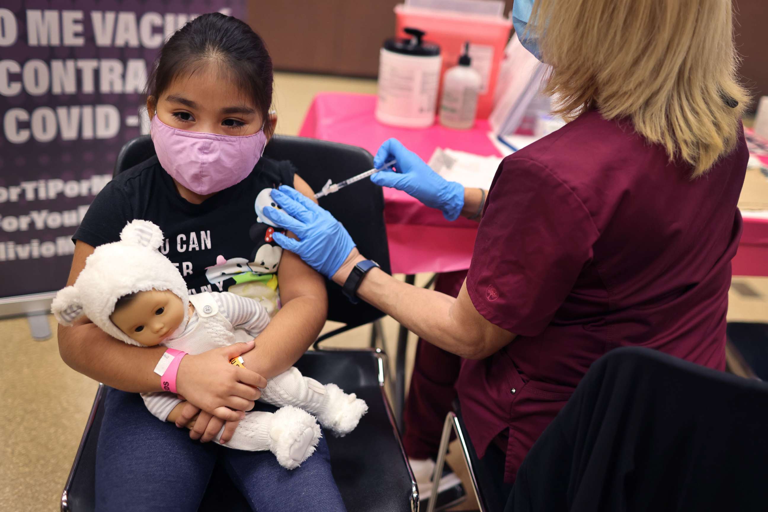 PHOTO: First grade student, seven-year-old Rihanna Chihuaque, receives a covid-19 vaccine at Arturo Velasquez Institute on Nov. 12, 2021, in Chicago.