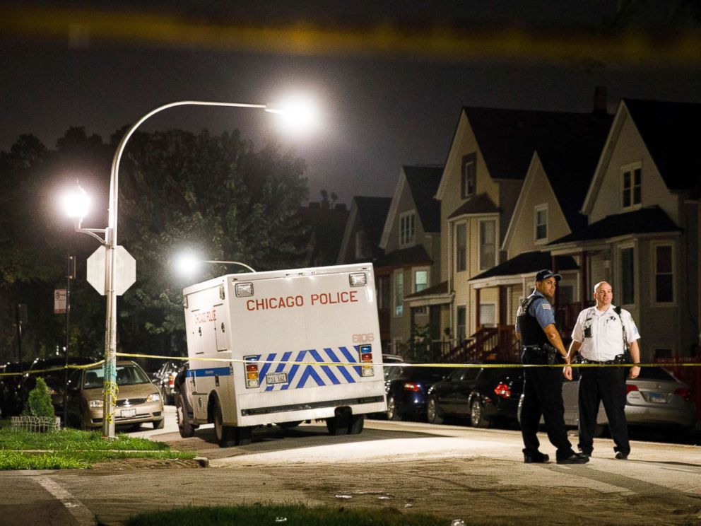 PHOTO: Police work the scene where two people were shot near the intersection of North Eldridge Avenue and North Drake Avenue, Aug. 19, 2018 in Chicago, Ill.